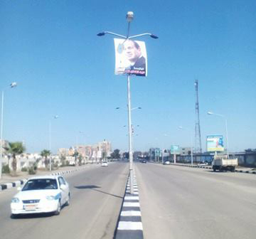 بالصور أعلام مصر وصور للسيسي بمدخل بورسعيد الجنوبي قبل افتتاح ظهر
